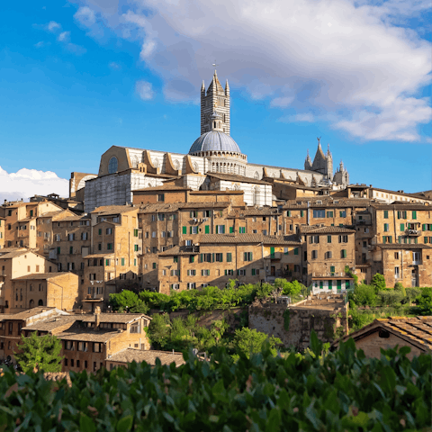 Head to the atmospheric streets of Siena for the afternoon, just a short drive away