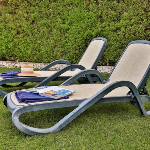 Relax and catch some rays on the sun loungers, in your own private garden