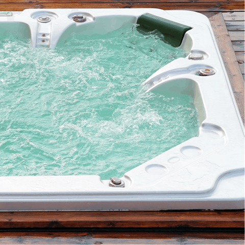 Treat yourself to a soak in the home's hot tub