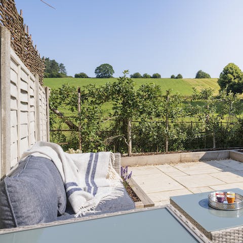 Enjoy a cup of coffee on the outdoor sofa in your private courtyard garden