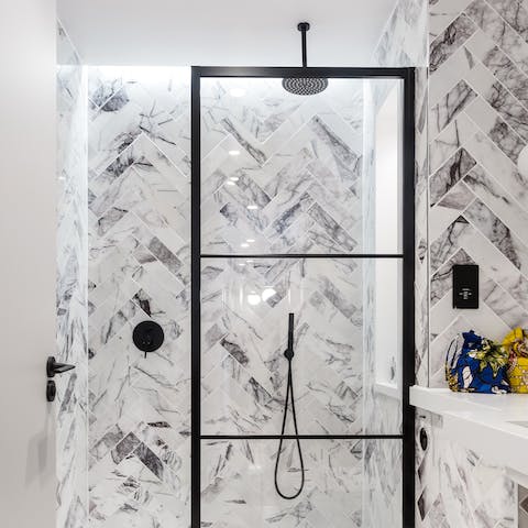 Start mornings with a long, luxurious soak under the rainfall shower