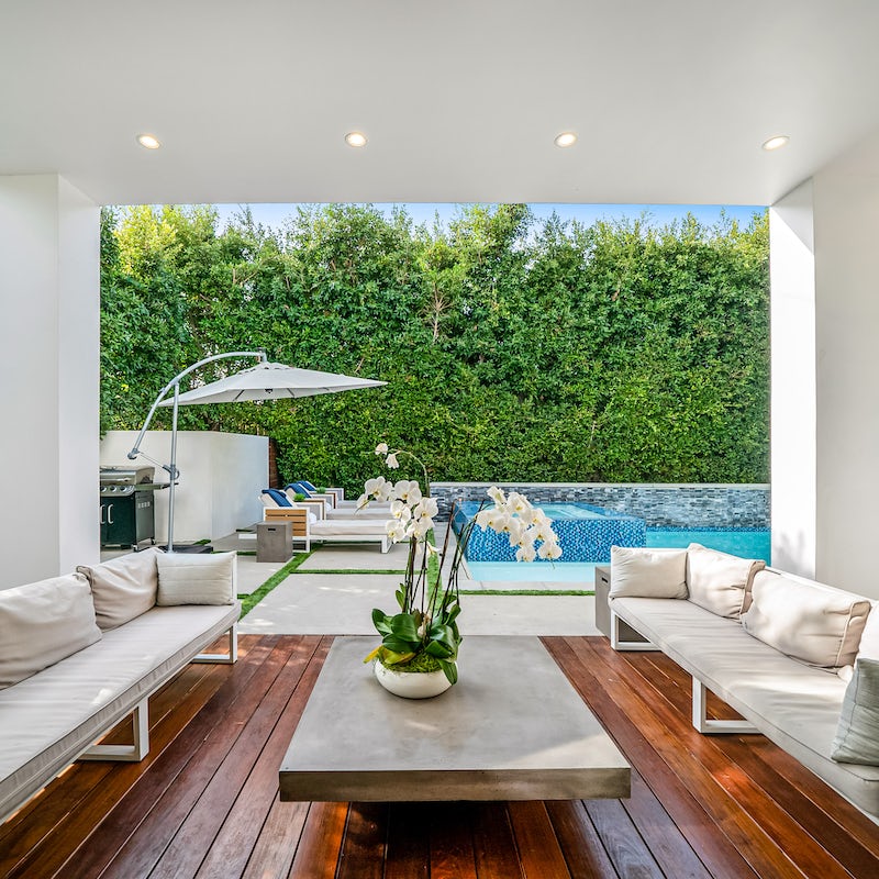 Relax on the low-slung covered seating out on the deck