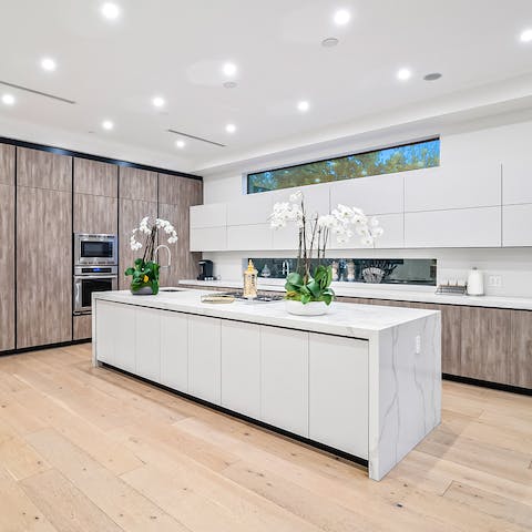 Take inspiration from the clean lines and luxurious natural materials in the kitchen