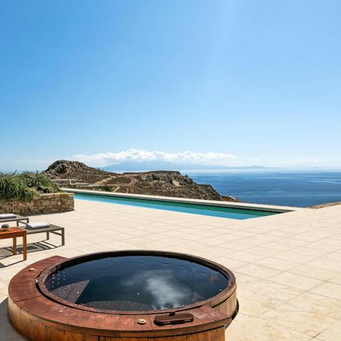 Treat yourself to a long session in the hot tub as you admire the sea views