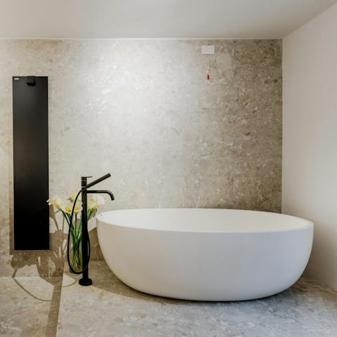 Relax in the freestanding bath after a busy day exploring Tuscany