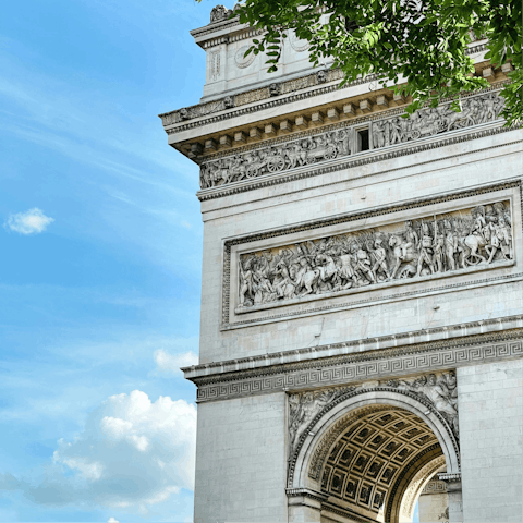 Marvel at the Arc de Triomphe, a ten-minute walk away