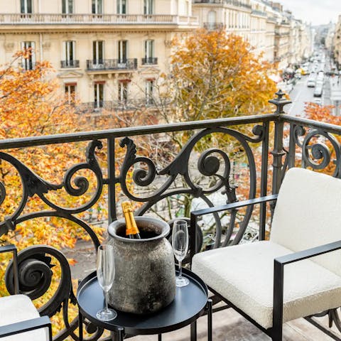 Drink in the views of Avenue George on the balcony