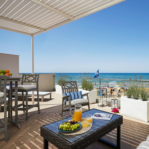 Settle down on your private terrace for breakfast with a sea view