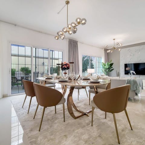 Gather for breakfast at the sleek dining table in the open living area