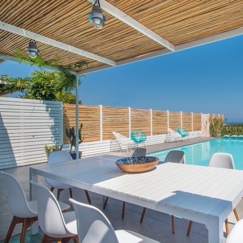 Cool off with a quick dip in the pool before an alfresco lunch under the wooden pergola