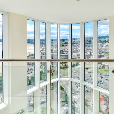 Lookout on sweeping views of Swansea bay from the double height, floor-to-ceiling windows