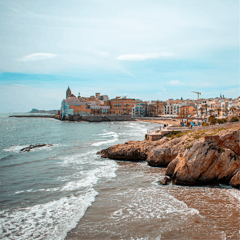 Visit the coastal town of Sitges, an eighteen-minute drive away