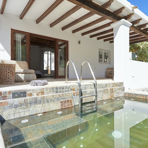 Soak in the outdoor heated spa pool