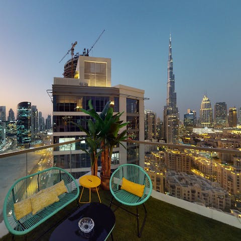 Sip cocktails overlooking the Burj Khalifa from your balcony