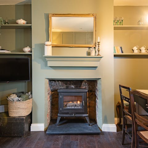 Spend chilly evenings curling in by the log burning stove