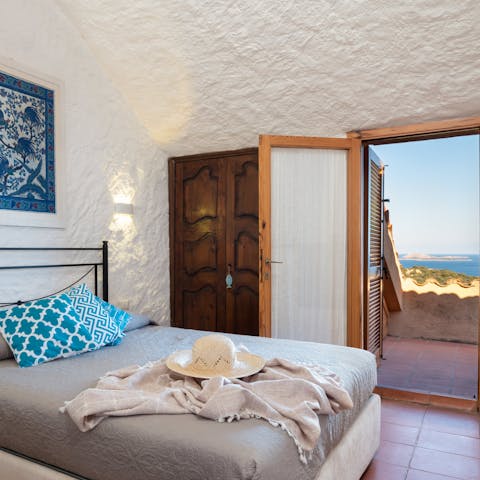 Wake up to panoramic views of the Portisco Gulf from your private balcony