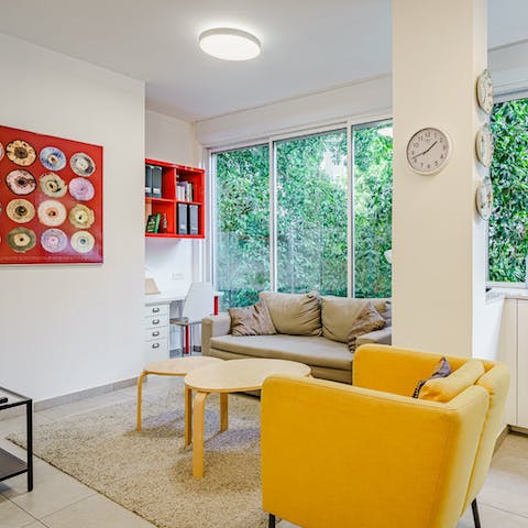 Relax in the bright living room with its leafy views or catch up on work at the handy desk space here