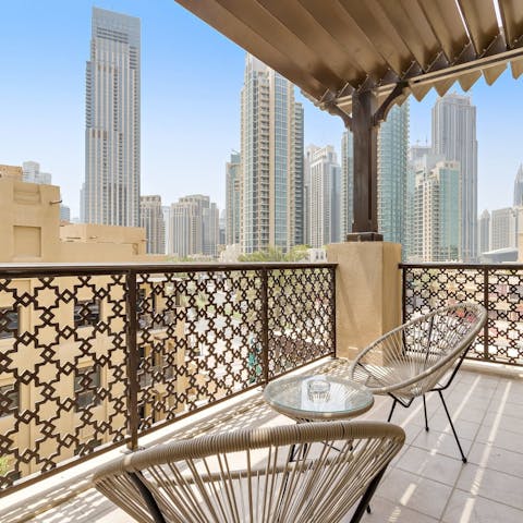 Enjoy a glass of jellab on the private balcony and admire the Burj Khalifa views