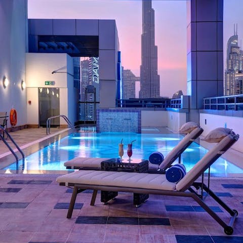 Relax in the rooftop pool and sun beds