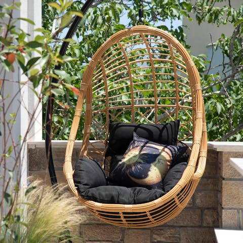 Grab a book and get comfortable in the swinging egg chair
