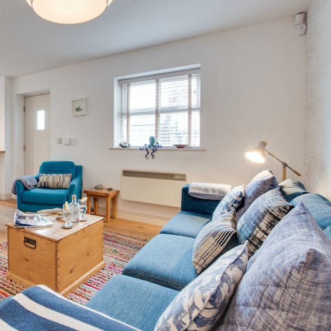 Sink into a cushion-festooned sofa for a cosy evening in