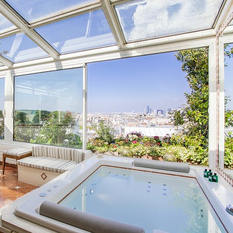 Slip into the Jacuzzi tub and gaze out over Paris