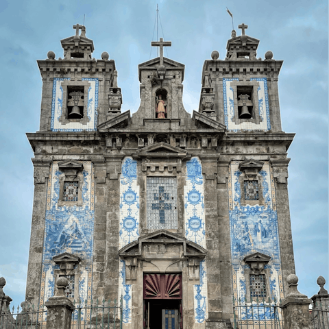 Visit the beautiful Igreja de Santo Ildefonso, a three-minute walk away