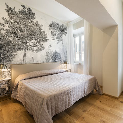 Relax and unwind in this ample bedroom suite whose overlook the historic city