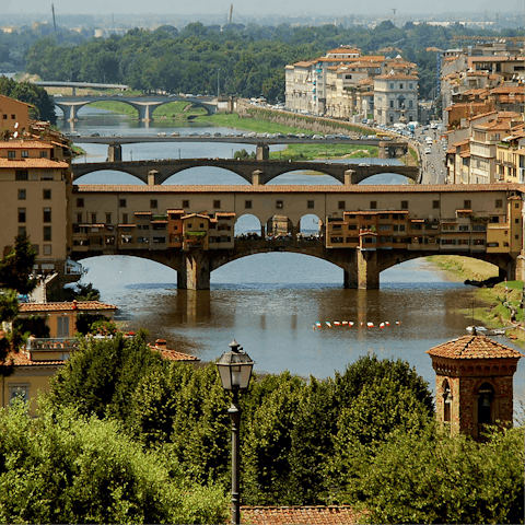 Cross over the River Arno on the ancient and scenic Ponte Vecchio