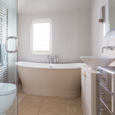 Take a relaxing soak in the freestanding tub