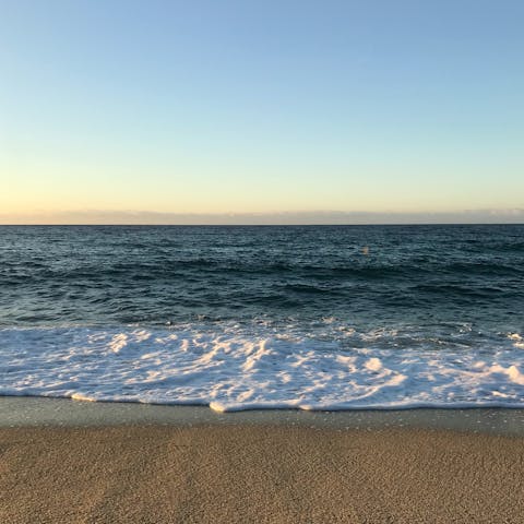 Slip on your sandals and stroll down to Elia Beach