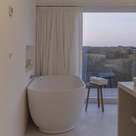Take a long, relaxing bath in the free standing tub, looking out at the gorgeous view