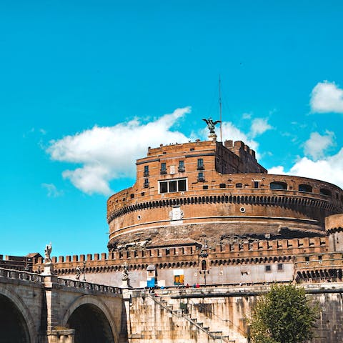 Cross the Ponte Sant'Angelo to admire the Castel Sant'Angelo, it's a short walk from your home