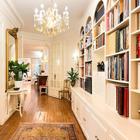 Relax with a book and a glass of wine in this classically Parisian apartment