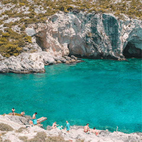 Visit the secluded cove and crystal-clear waters of Porto Limnionas, forty minutes away