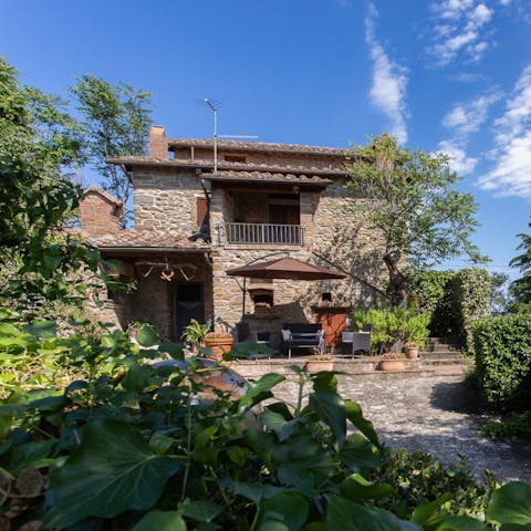 Retreat to the shade of the umbrella with a good book and a glass of local wine