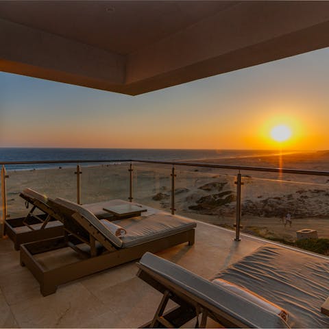 Watch as the sun sets over the ocean from the private terrace