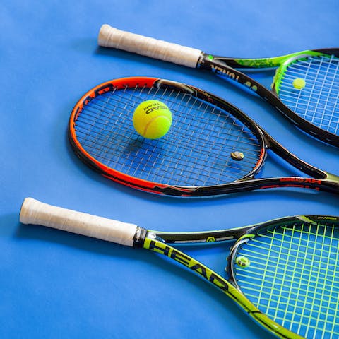 Play a few sweaty matches on the communal tennis court