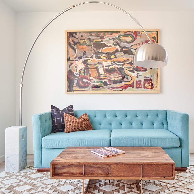 Lounge on the powder blue sofa with your favourite cocktail in hand
