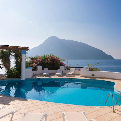 Gaze out at the Aegean Sea from your private swimming pool