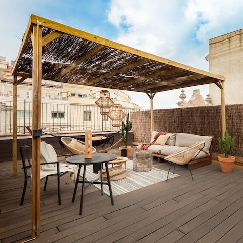 Enjoy cocktails from the comfort of your rooftop oasis
