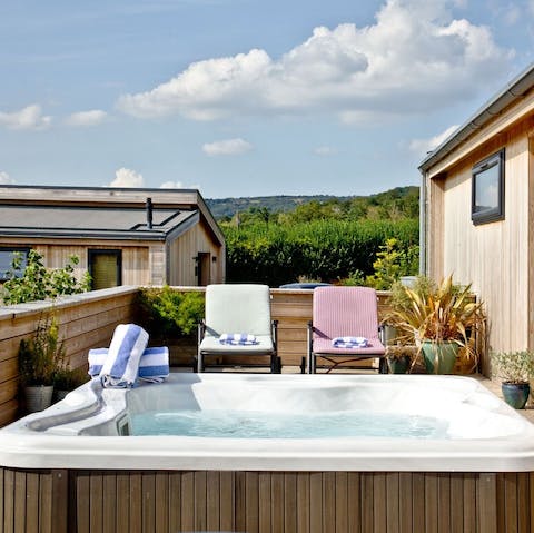 Soak in the tub under the stars at night, and relax on the sun loungers during the day