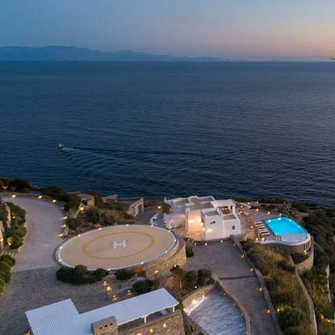 Arrive in style by helicopter or private boat