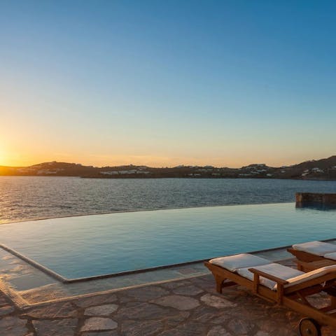 Swim laps in the infinity pool at sunset for a stunning view