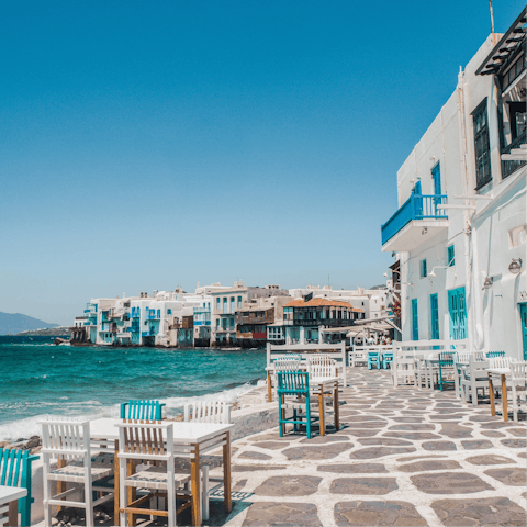 Reach the seafront cocktail bars and restaurants of Mykonos Town in ten minutes by car