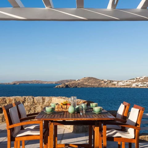 Dine outdoors with an inspiring view over the Aegean Sea
