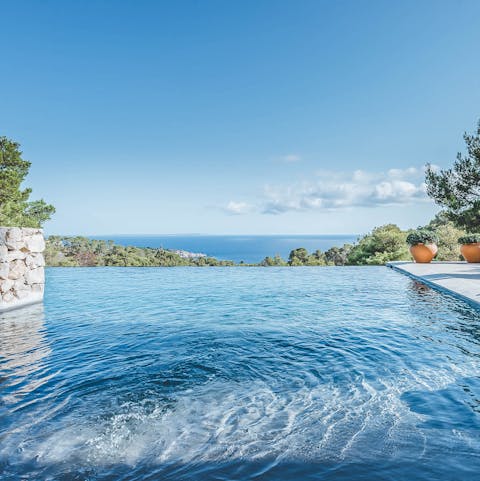 Slip into the infinity pool and gaze out at the sea