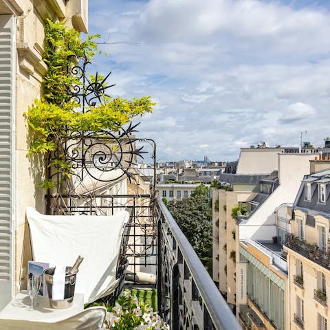 Pad out to the balcony and admire the typically Parisian views