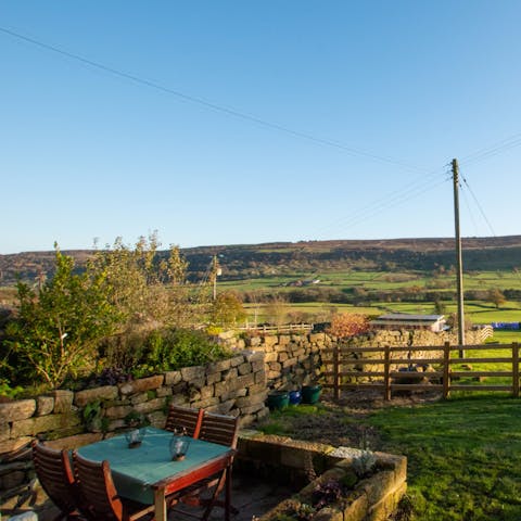 Enjoy a spot of cream tea in the garden accompanied with sprawling views of the dale  