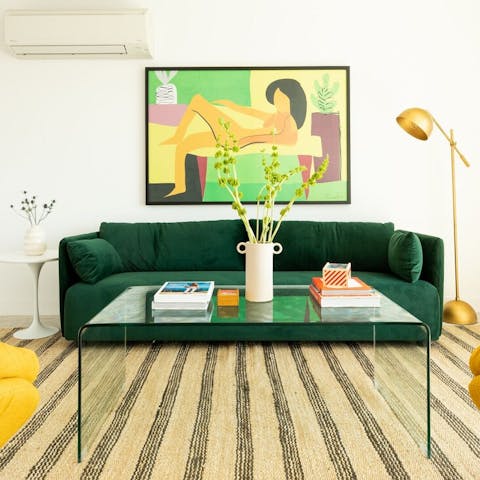 Lounge on the green velvet sofa